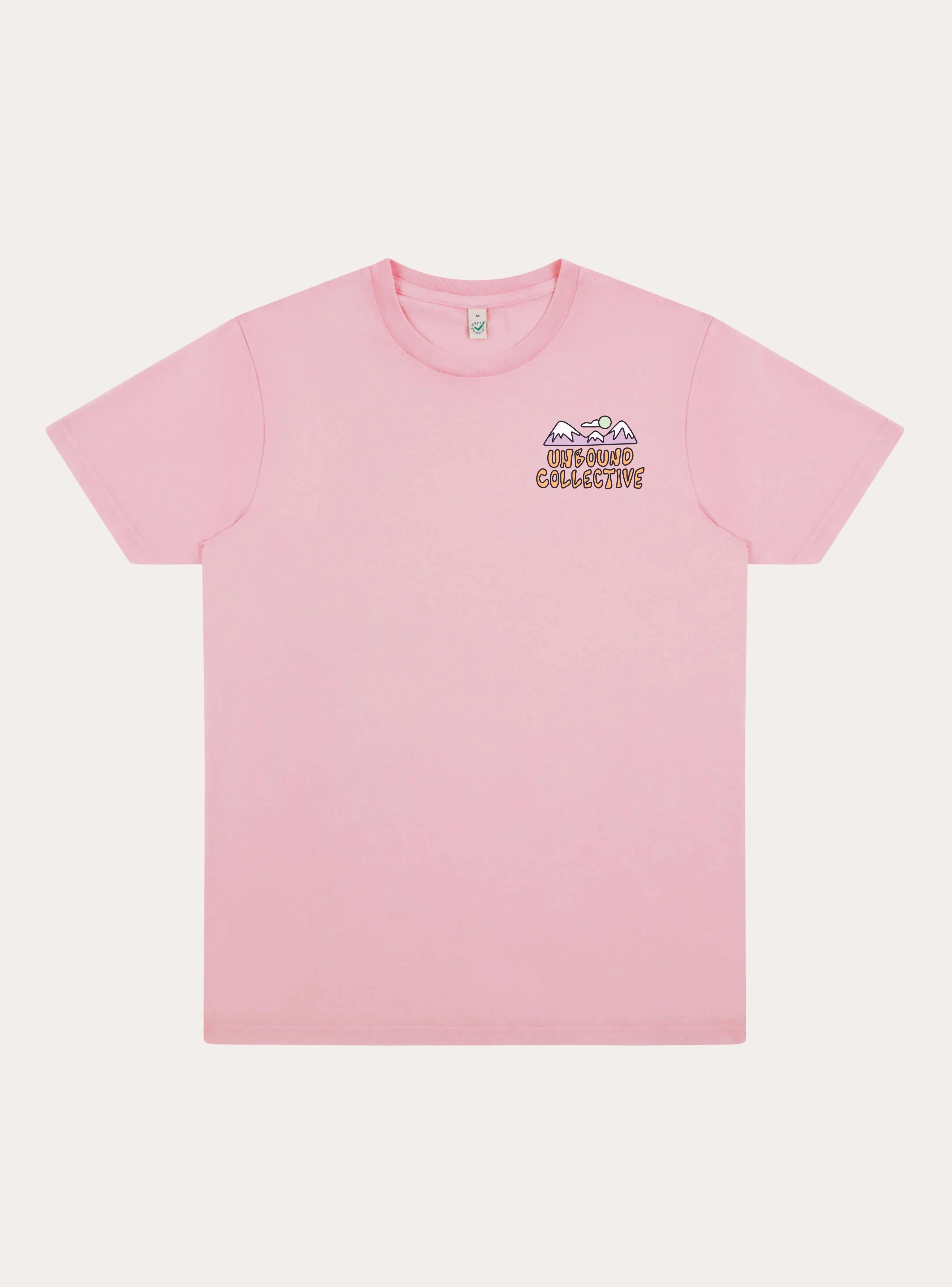 Faded pink unisex t-shirt with small mountain and sun graphic and Unbound Collective logo