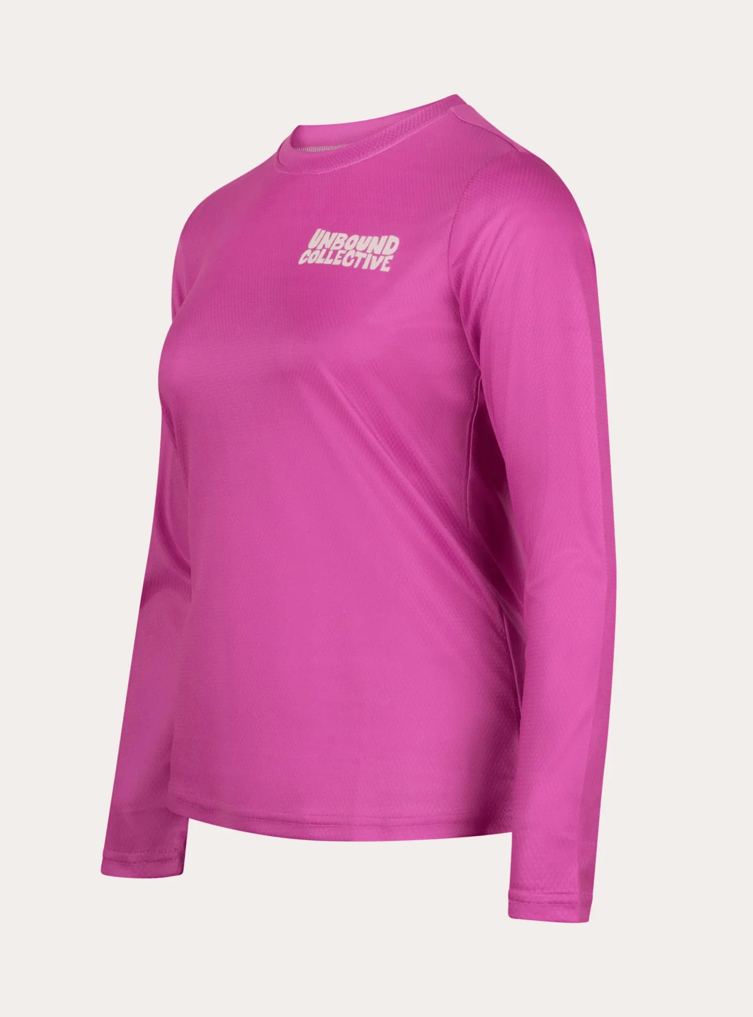 Women's long sleeve pink mountain bike jersey with Unbound Collective logo