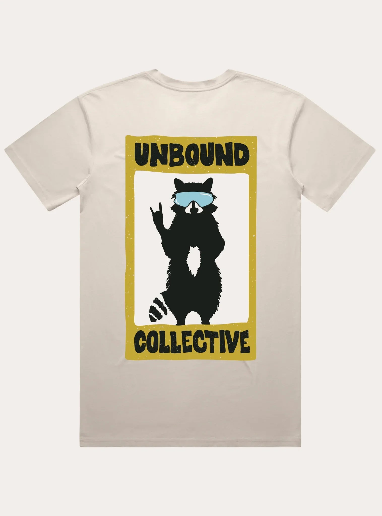 Beige men's t-shirt featuring a graphic of a raccoon wearing blue sunglasses making a rock hand sign, framed by text reading Unbound Collective