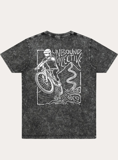 Black acid-wash unisex tee with white graphic of mountain biker and Unbound Collective text